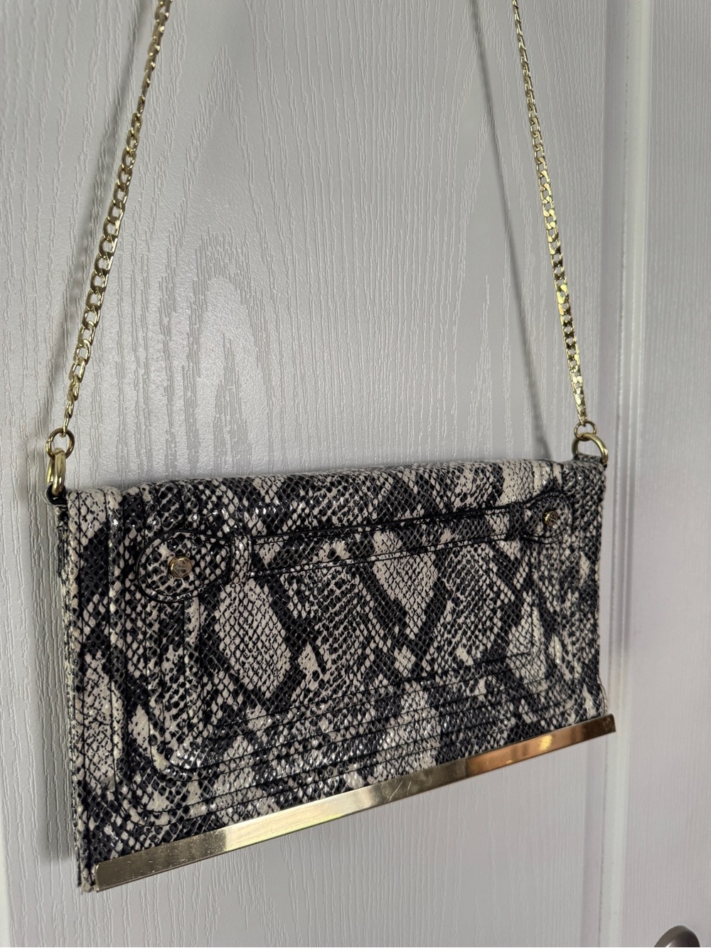 Sam & Libby Black and White Snake-Print Crossbody Clutch with Gold Trim